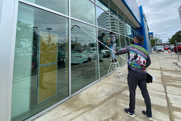 A man cleaning a window